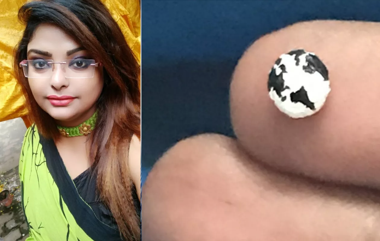 SMALLEST PAINTING OF WORLD MAP ON RED LENTILS GRAIN