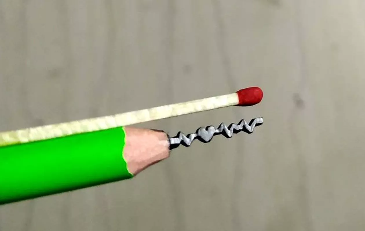 SMALLEST CARVING ON PENCIL GRAPHITE