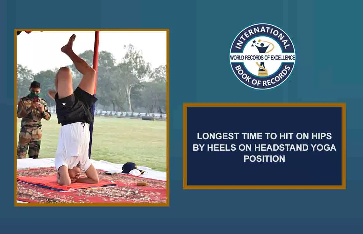 LONGEST TIME TO HIT ON HIPS BY HEELS ON HEADSTAND YOGA POSITION