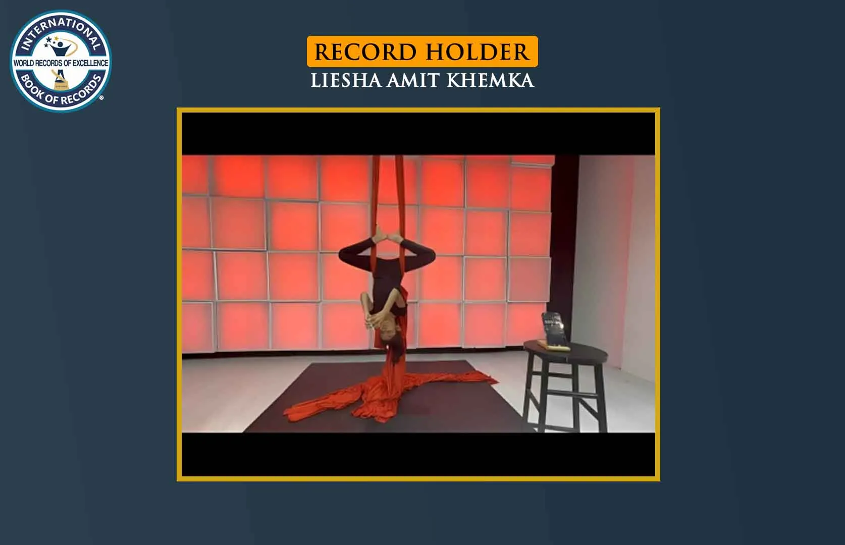 FASTEST TO SOLVE 3X3 RUBIK’S CUBE WHILE HOLDING AN INVERTED AERIAL BUTTERFLY POSE (KID)