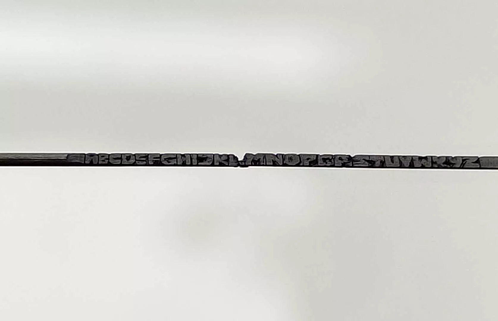 FASTEST TO CARVE ALL ALPHABETS ON A  SINGLE PENCIL LEAD (TEENAGER)